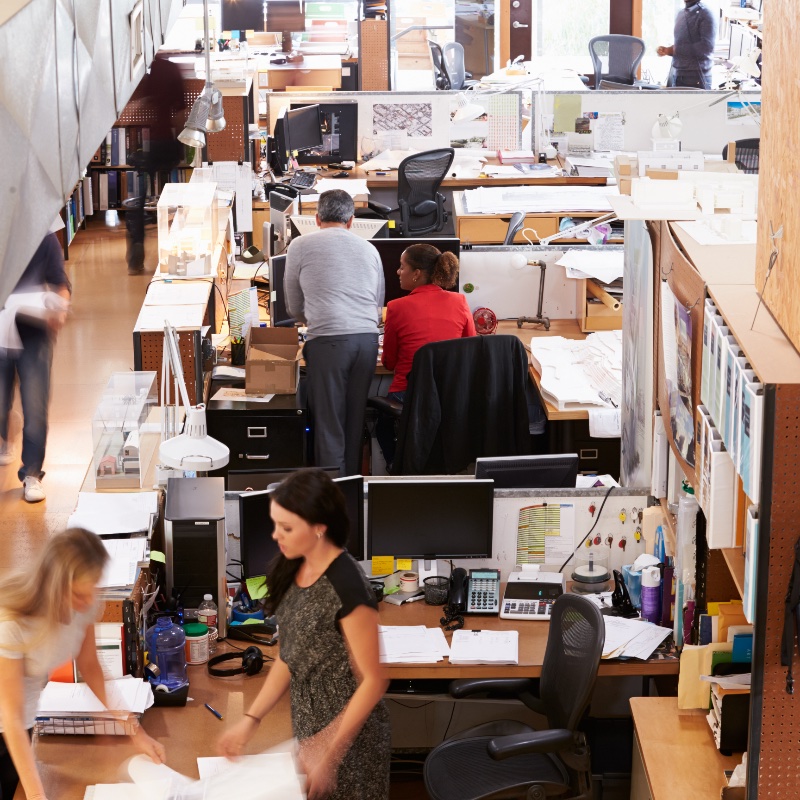 Interior Of Busy Architect's Office With Staff Working