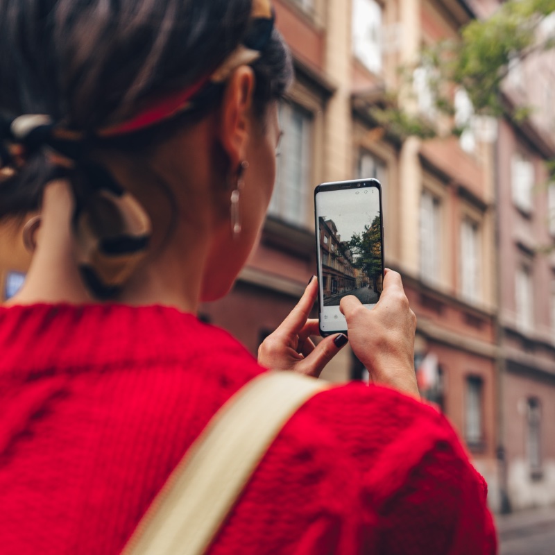 Young woman taking photo in Poland